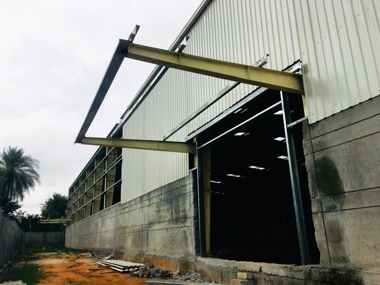 Heavy structural steel extension framework with concrete walls under construction