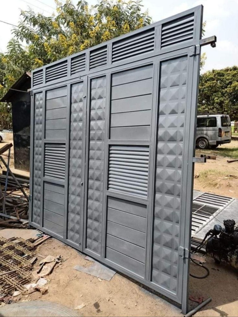 Heavy Grey Compound Sliding Gate with Louvers in Yard