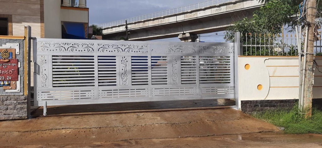 Large Silver Sliding Steel Gate with CNC Design near Metro Track